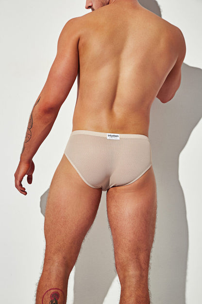 Beige mesh brief from the back, showcasing full rear coverage and breathable fabric.
